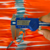 Close-up of premium natural latex band showing 0.55mm thickness and sharp orange color for improved visibility | Armament Mfg.