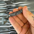 Detail view of 215mm silver flat band demonstrating excellent elasticity and powerful rebound for precision shooting | Armament Mfg.