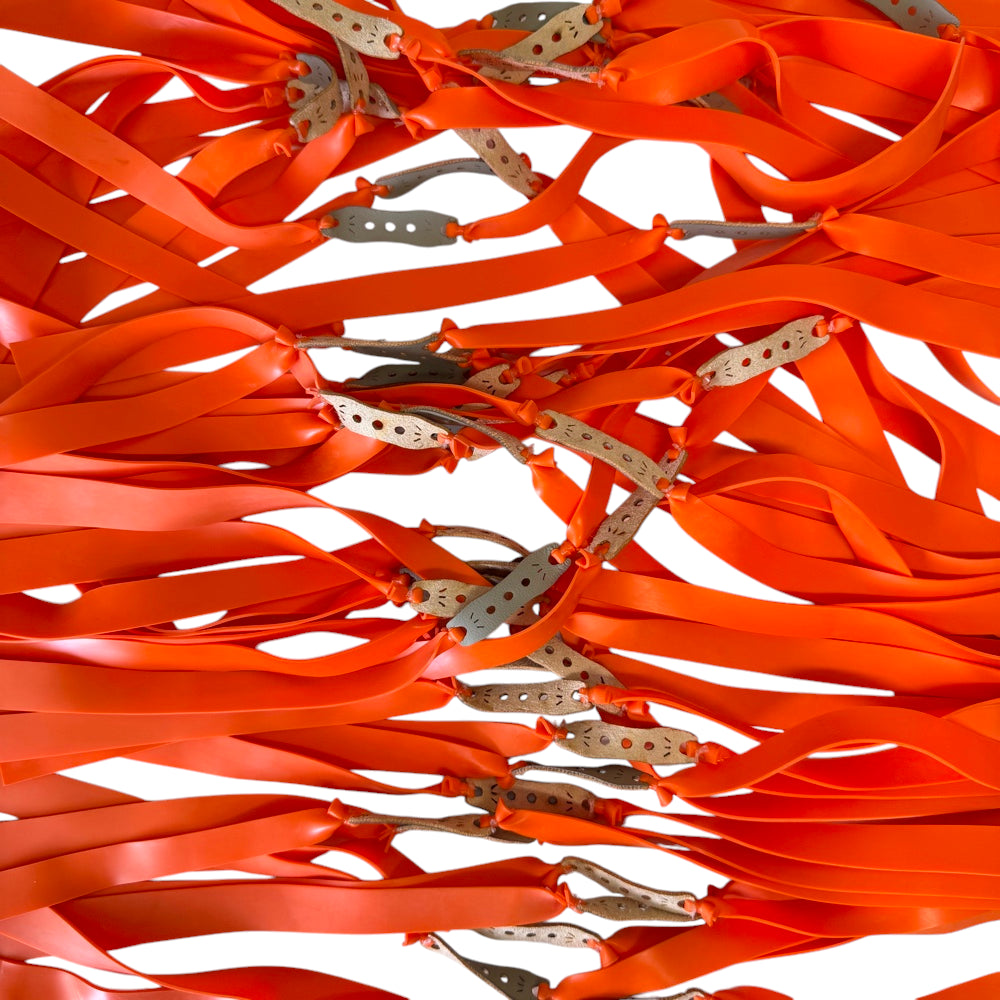Orange 1.1mm high-performance latex flat band with 20mm-12mm taper for powerful slingshot shooting | Armament Mfg.