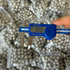 Close-up of eco-friendly magnetic clay ammo showing consistent round shape for accurate slingshot shooting | Armament Mfg.
