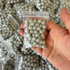 Magnetic clay slingshot ammo showing consistent diameter and light grey color for target practice | Armament Mfg.