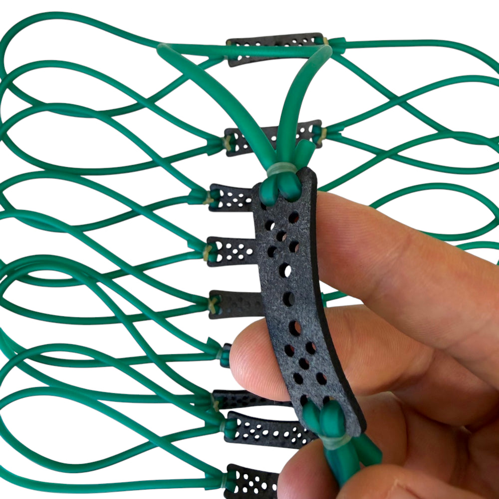 1745 latex looped tube slingshot band in green colour pouch close up | Armament Mfg. 
