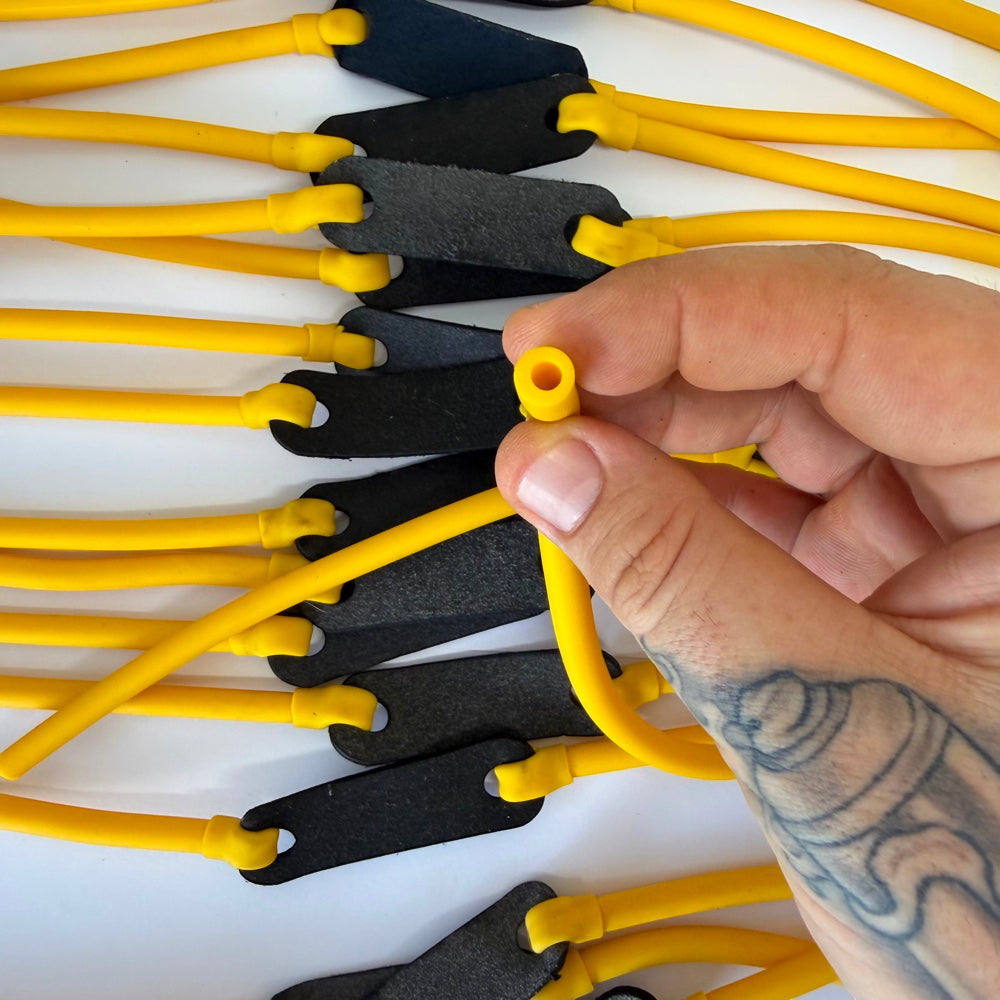 Close-up of 6mm tubular latex slingshot band showing thickness | Armament Mfg.