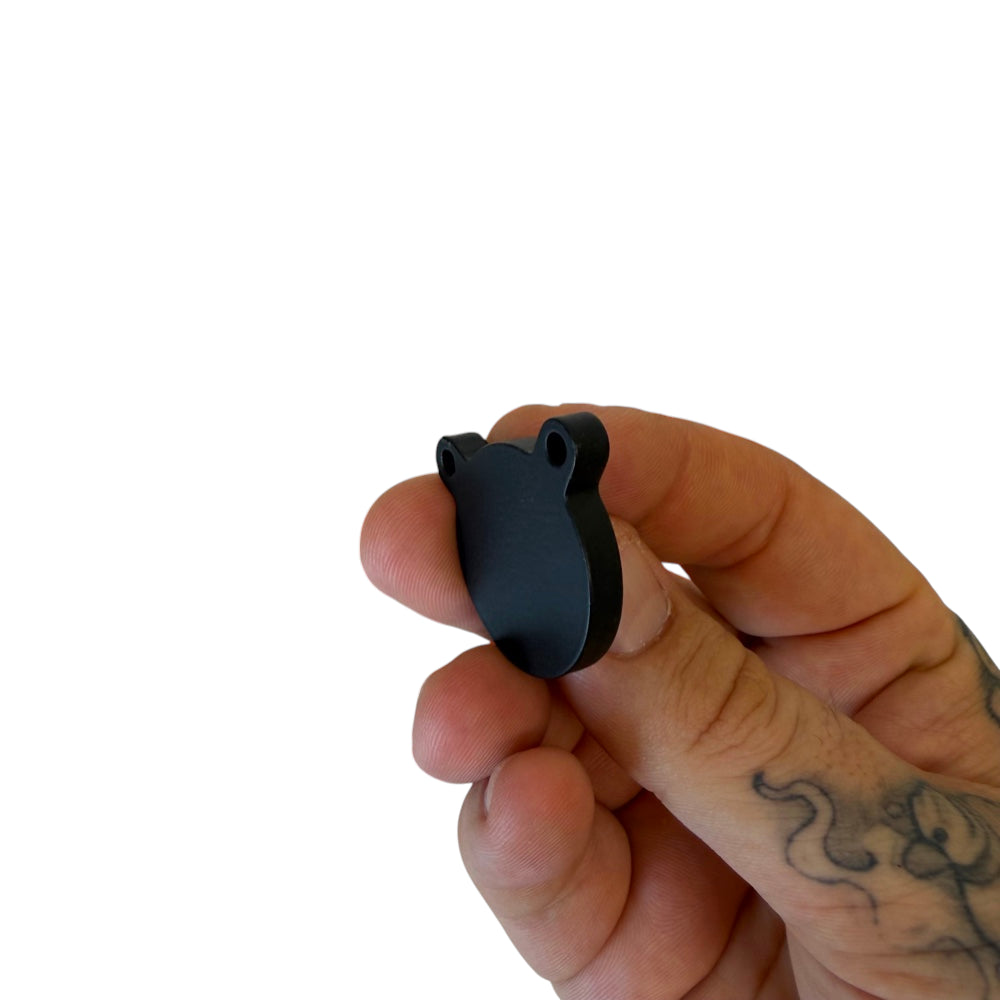 Compact 1-inch reactive gong target demonstrating clear ring on impact for precision shooting practice | Armament Mfg.