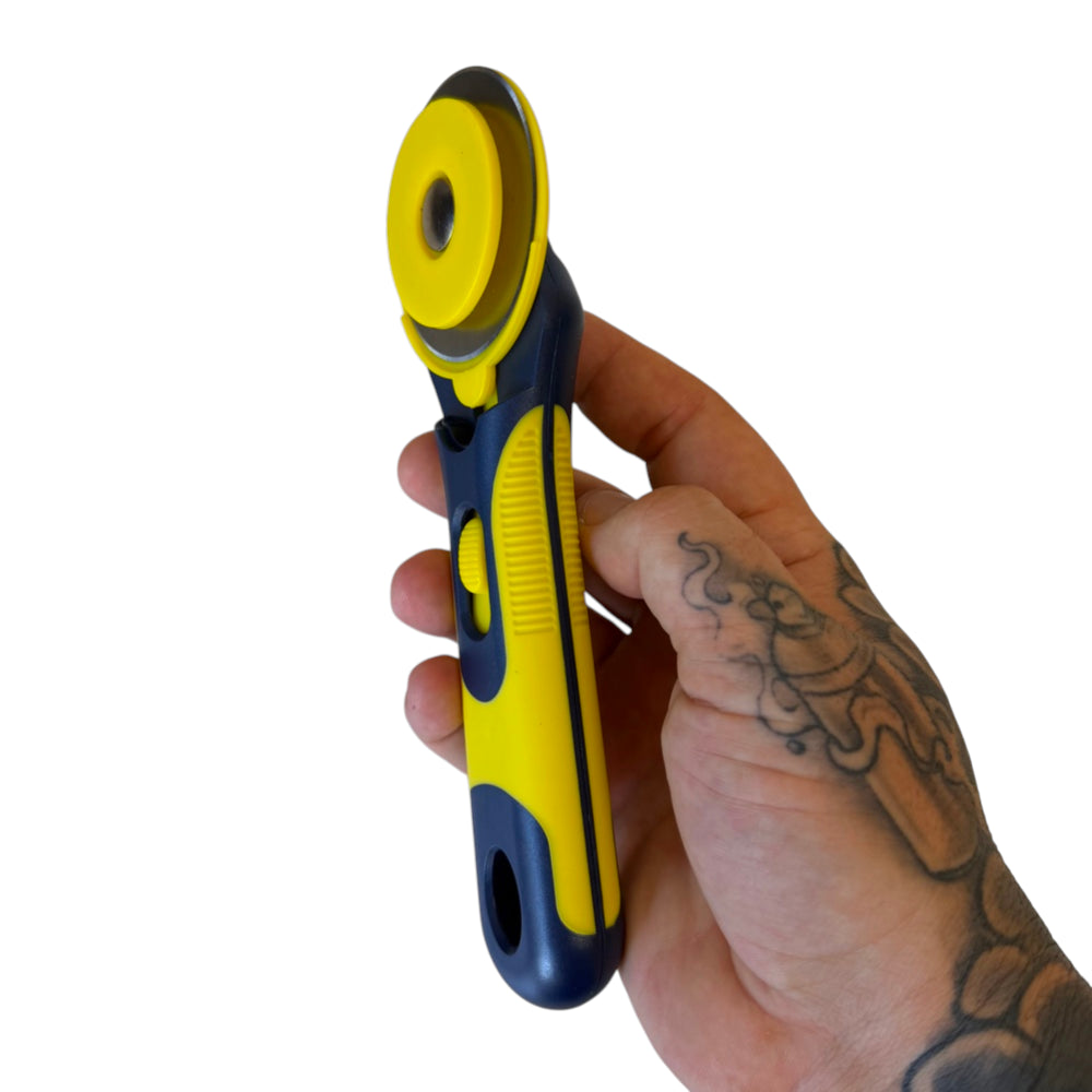 Side view of rotary cutter demonstrating ergonomic handle design for comfortable DIY band building | Armament Mfg. 