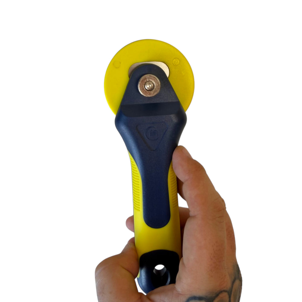 Detail of 60mm roller cutter blade compatible with cutting mats for clean latex, fabric and neoprene cuts | Armament Mfg.