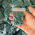 Magnetic clay slingshot ammo showing consistent diameter and green color for target practice and training | Armament Mfg.