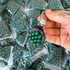 Detail view of 9.5mm biodegradable clay pellets demonstrating magnetic properties for easy retrieval | Armament Mfg.