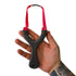 Hand holding a black slingshot with red straps against a white background