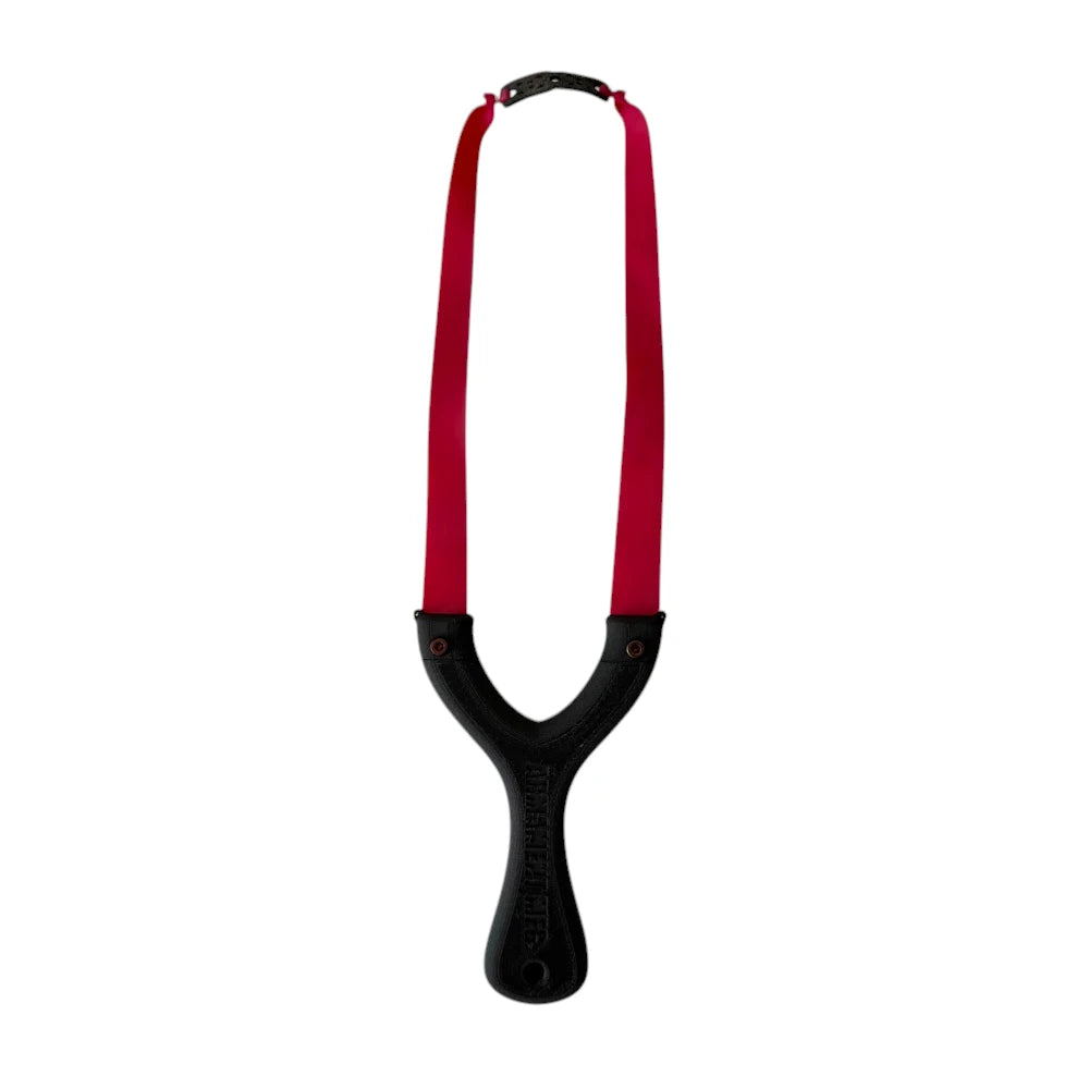 Black daily driver slingshot with red flatband on a white background