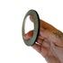 Close-up of durable slingshot band tying tape showing side profile for securing flat and tapered bands to slingshot frames | Armament Mfg.