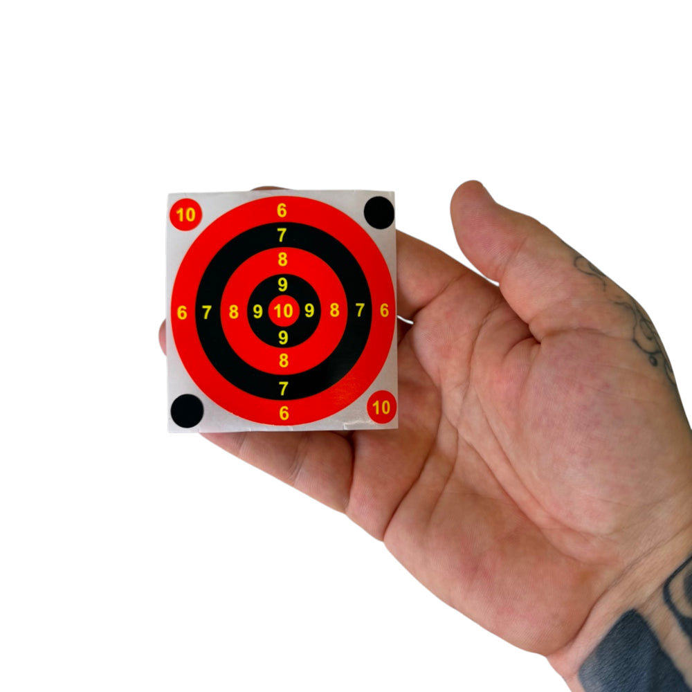 Close-up of high-visibility splatter target showing bright color splash effect for easy shot tracking without walking downrange | Armament Mfg.