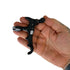 Close-up of CNC-machined four-finger release aid showing finger grooves and trigger mechanism | Armamet Mfg.