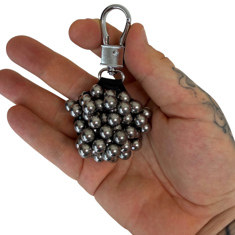Close-up of strong magnetic surface ammo holder showing secure storage for slingshot ammunition retrieval | Armament Mfg.