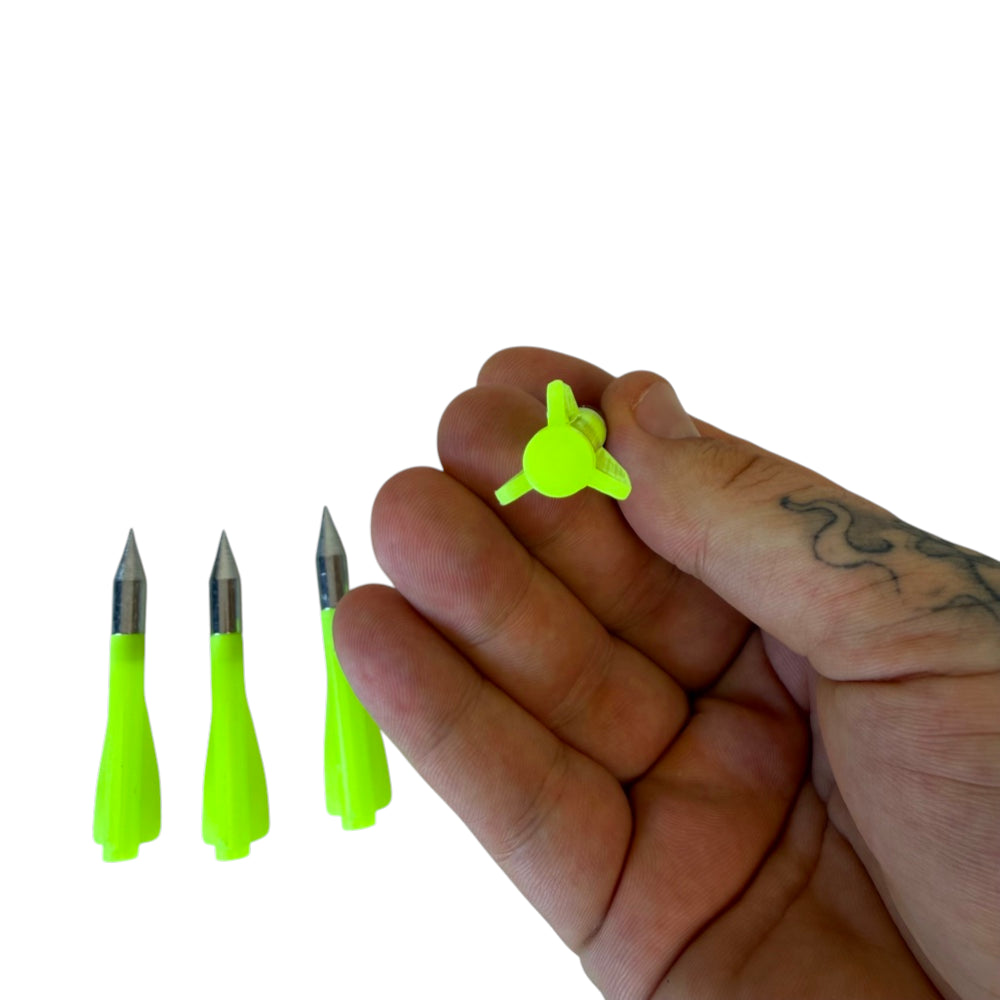Detail view of precision darts demonstrating flight characteristics for compatible shooting setups | Armament Mfg.
