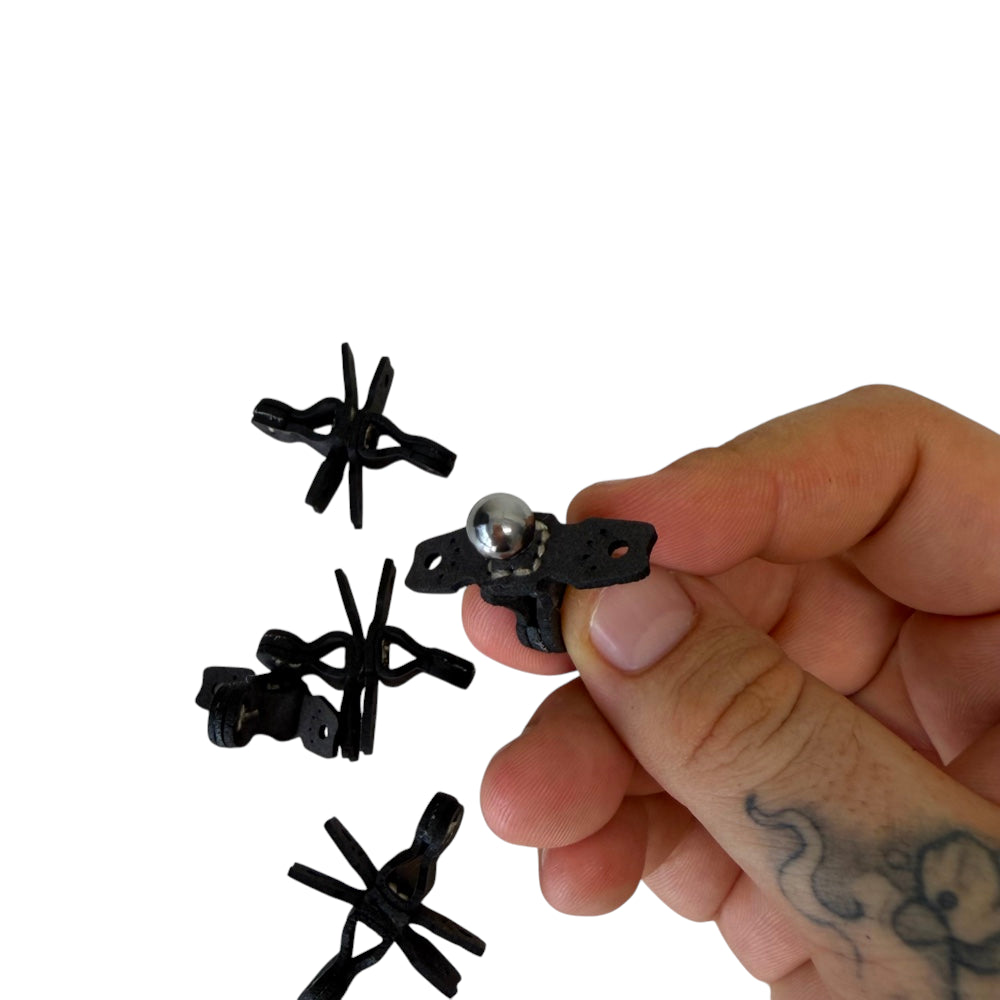 Detail of magnetic centering pouch with 9mm steel ball ammo showing automatic alignment capability | Amament Mfg.