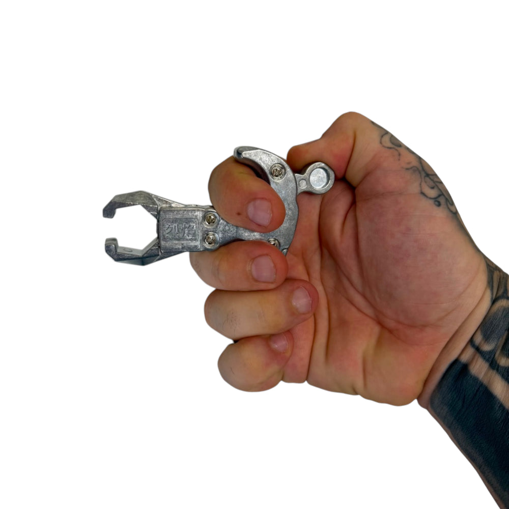 Close-up of slingshot release aid showing spreader design for improved control and consistent release | Armament Mfg.