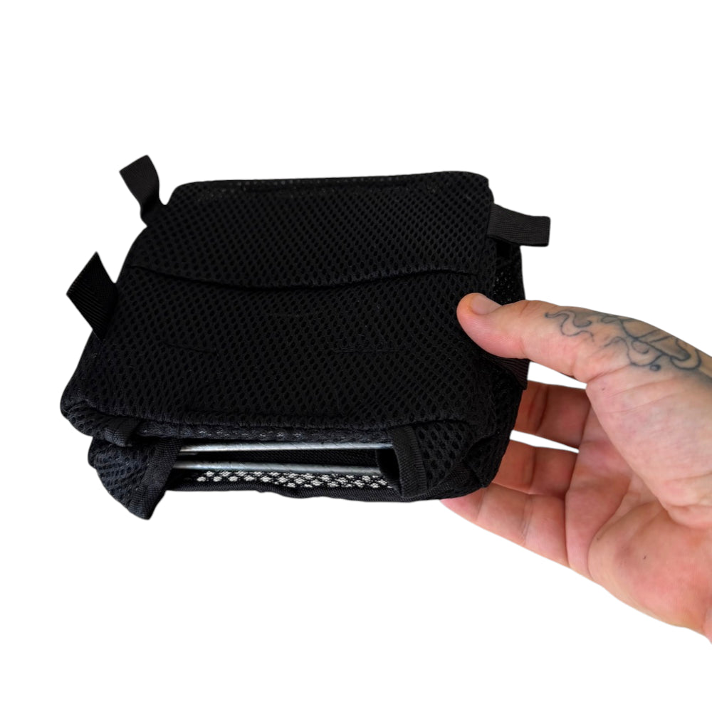 Compact folded slingshot catch box showing portable 15cm x 15cm storage size | Armament Mfg.